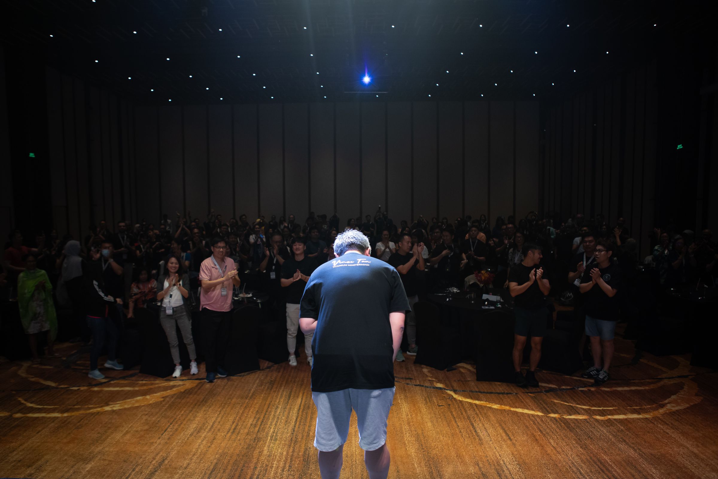 Vince Tan teaching hands-on business strategies in intimate workshop setting